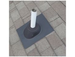 A black roof boot used to penetrate the roof so a white pipe can pass through