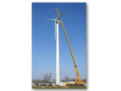 Using a crane to raise a wind turbine tower
